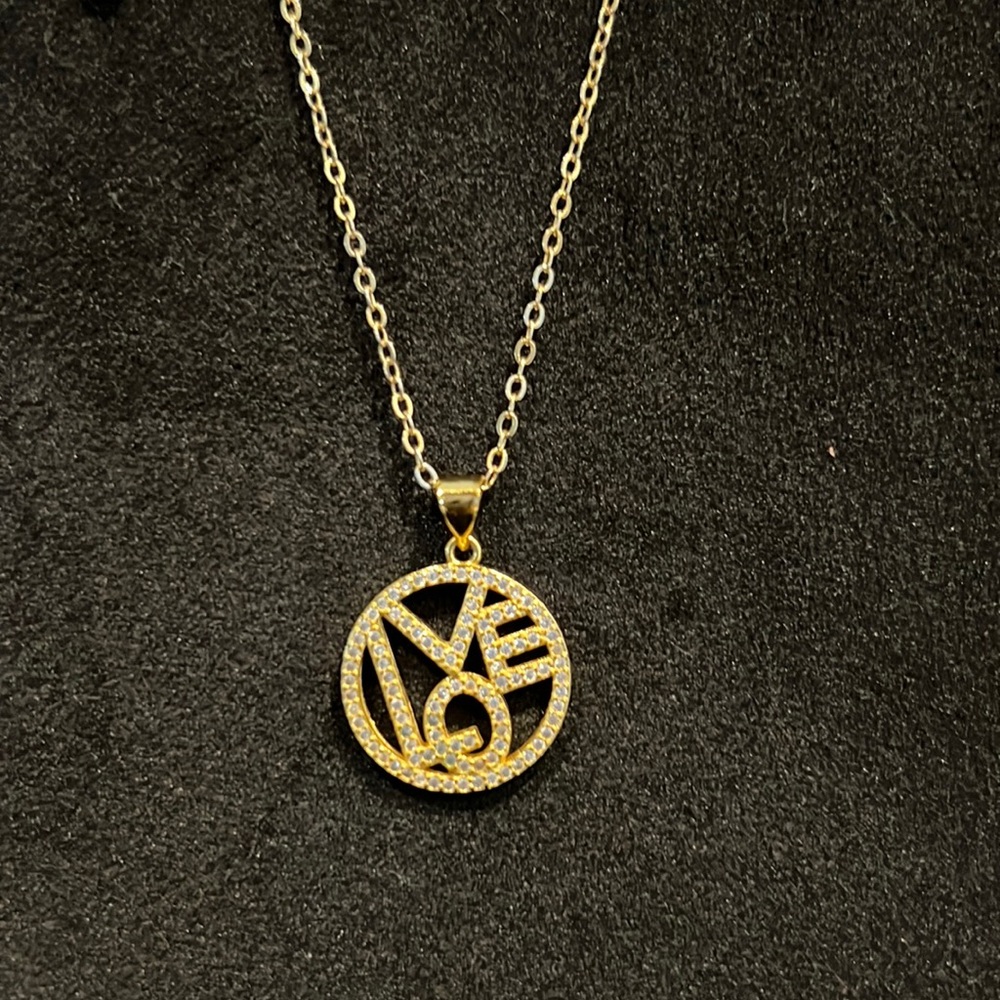 Gold love necklace.